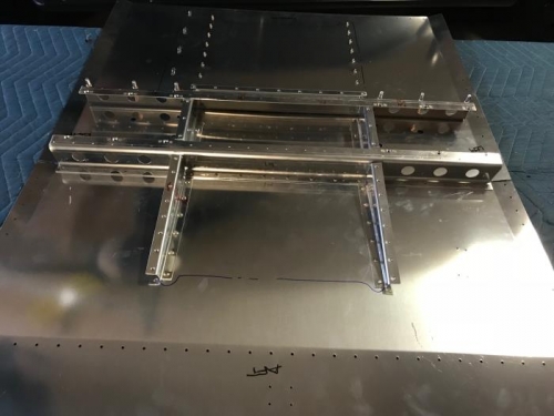 Riveted floor assembly