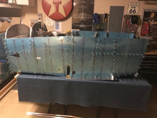 Left forward fuselage skin clecoed to assembly