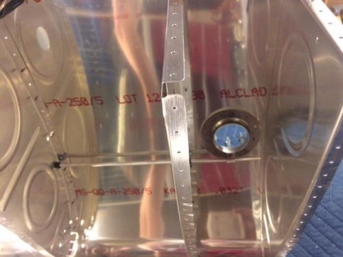 Breather line and bracket on filler neck