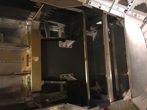 Wrap installed on the forward floor assembly