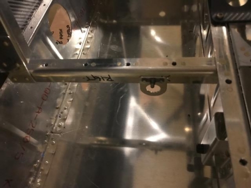 Cable guids and cross member in floor