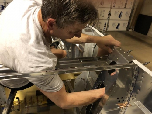 Reaching up through the gear box for connecting rivets