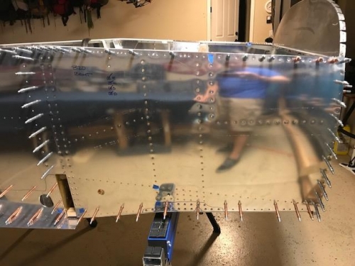 Right forward skin riveted into place