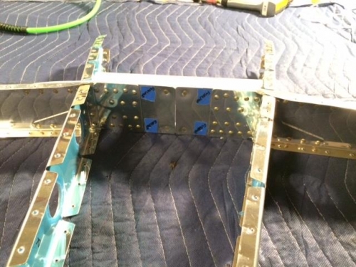 Riveted front spar support