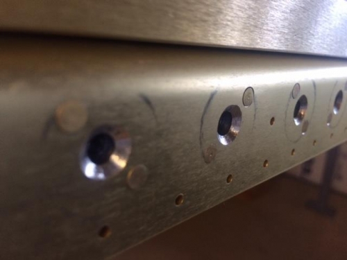 countersunk screw heads and flush riveted attachment