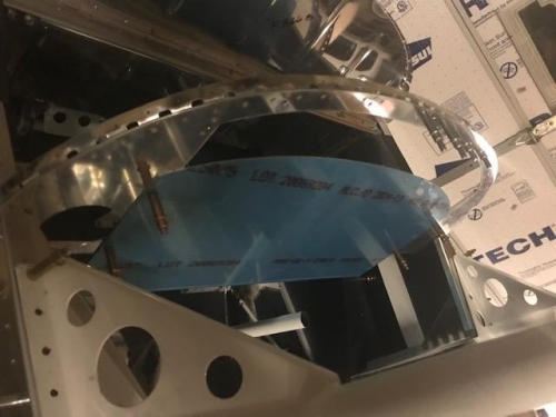Panel assembly cleoced into front of fuselage
