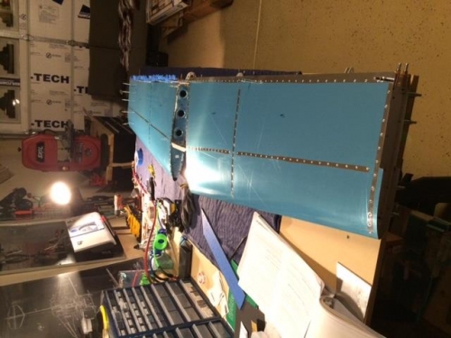 Horz. stabilizer with skin riveted to center ribs and forward spar.