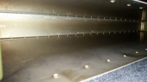Inside picture of top and bottom skin riveted to forward spar trailing edge