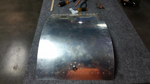 Exterior baggage door riveted all together