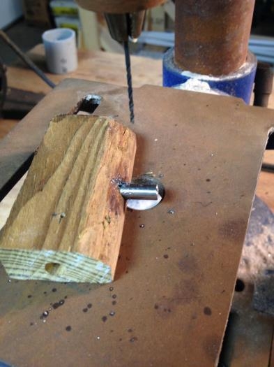 Wood block holding detent pin