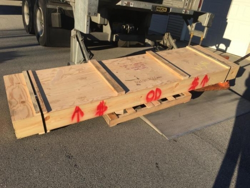 Single crate being unloaded, 226 lbs