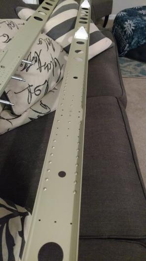 Front Spar turned over (on left), Rear Spar with white elevator brackets (Right)