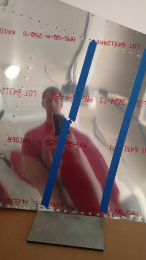 Taping over the manufactured heads, to keep the rivets in place.