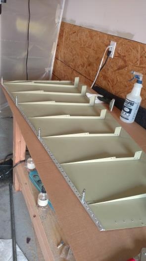 Placed stiffeners onto skin and riveted