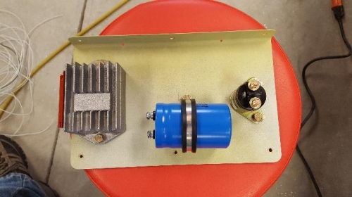 Voltage regulator, capacitor and solenoid
