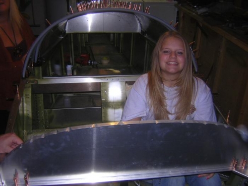 Grandaughter Katie sitting in fuselage checking fit!