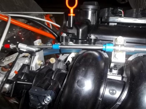 Throttle cable positioned