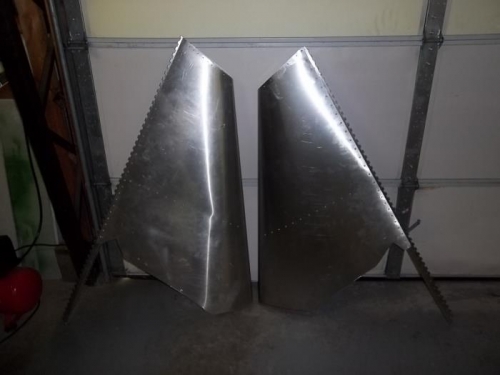 New fin (on right) has nose trimmed farther back
