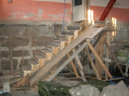 Concrete stairs down to the workshop.
