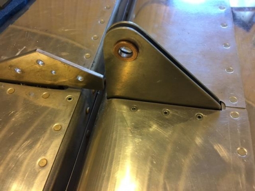 collared bearing in each side of flap bracket