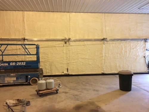 applied spray foam insulation to hangar door
