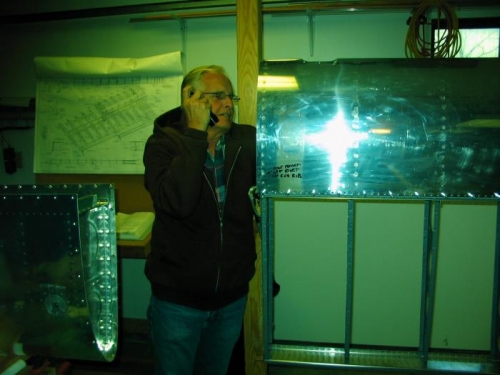 Dad reaching in to buck some rivets