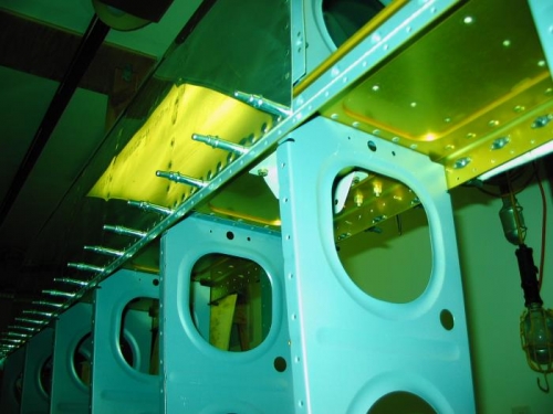 Ribs finally riveted to spar.