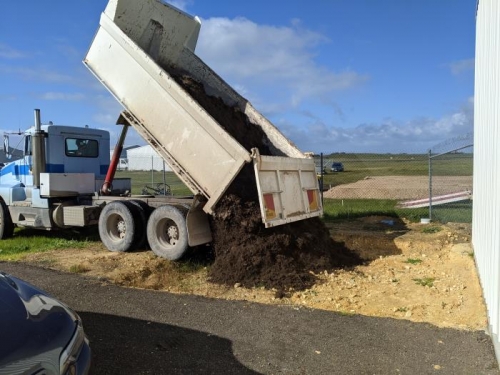 Some nice top soil going into the area to the front of the hangar