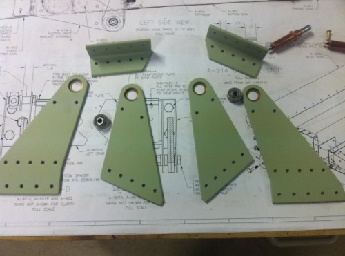 Some of the aileron hinge bracket parts all prepped for assembly