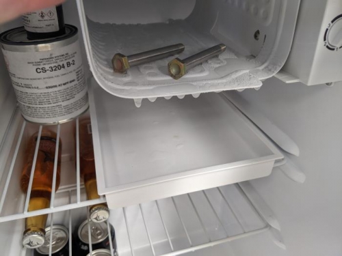Putting the bolts in the freezer helps get them in the hole easier