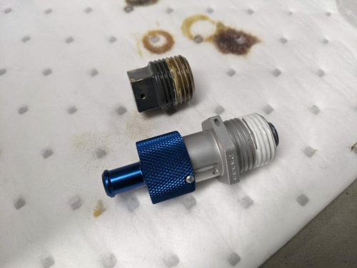 Replacing the original oil drain plug with this new easy-drain one