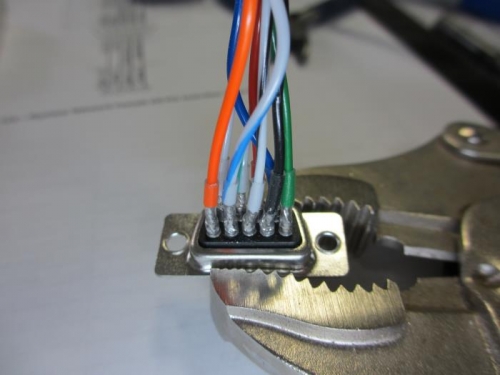 Soldering the 9-Pin Din plug. I use clear heatsherink over each individual connection