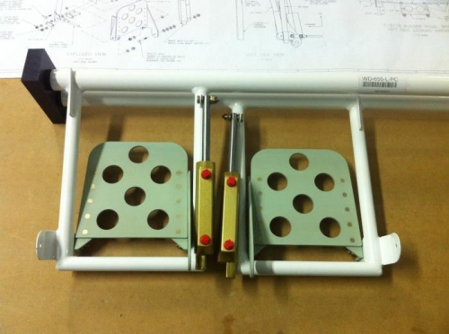 Mounted up in the rudder pedal assembly