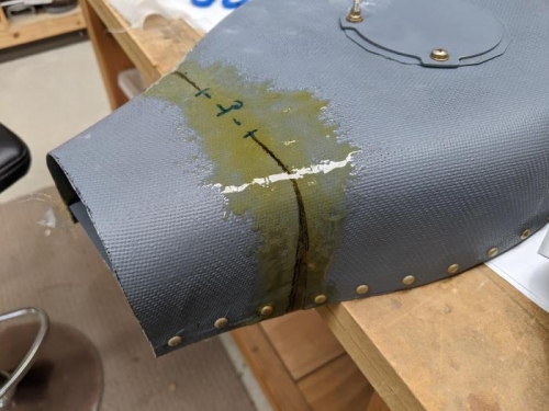 Resin and fibreglass cloth holding it in place
