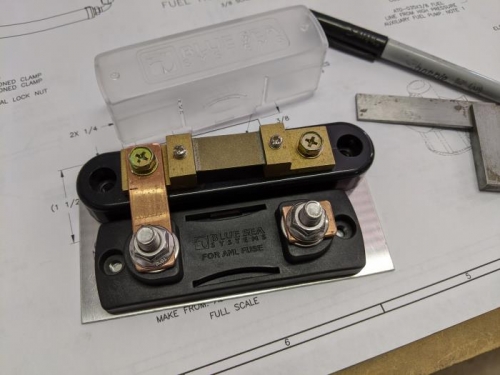 The ammeter shunt (top) and alternator fuse block (bottom) connected with a copper link