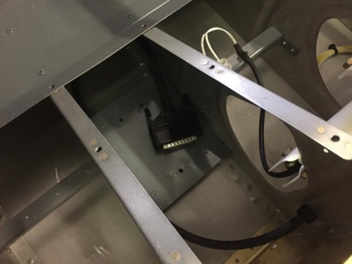 The transponder mounting bracket is now installed under the passenger side floor