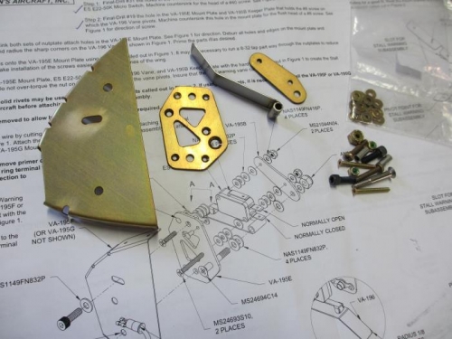 Most of the parts that make up the mounting bracket for the stall warning switch