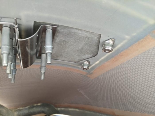 Inside view of the hidden oil door hinge and quarter turn fasteners