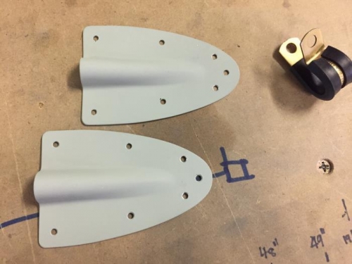 The two rudder cable fairings, with the rear rivet holes redrilled