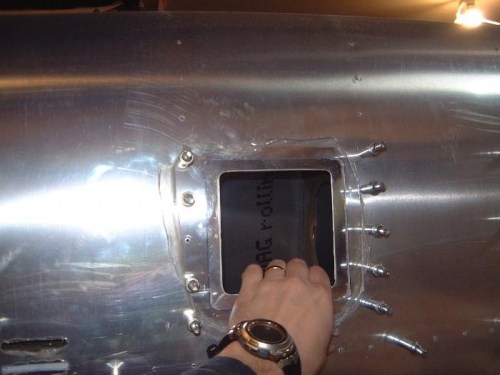 first inspection hole in the left wing.