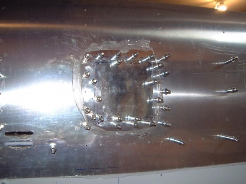 Inspection hole cover in place.