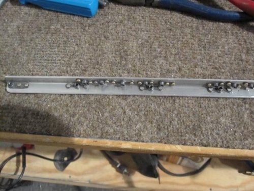 One of the rails for the radio stack with nutplates installed