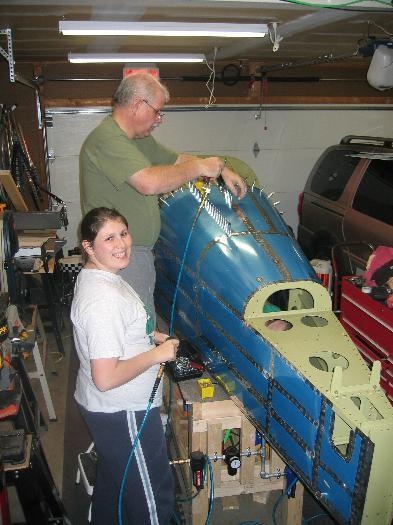 Renee helping with the clecos, Bob driving rivets, and Brad bucking from inside