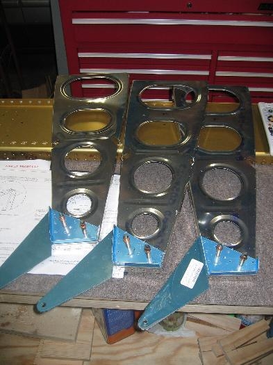 Three of the flap hinge bracket assemblies