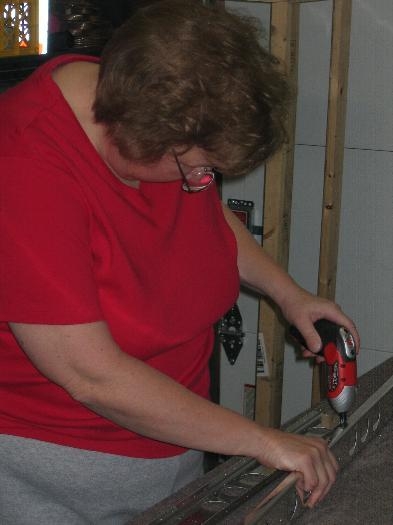 Janice assisting with deburring
