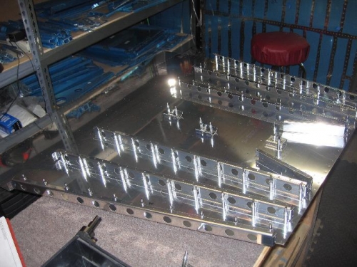 Forward fuselage bottom skin and ribs