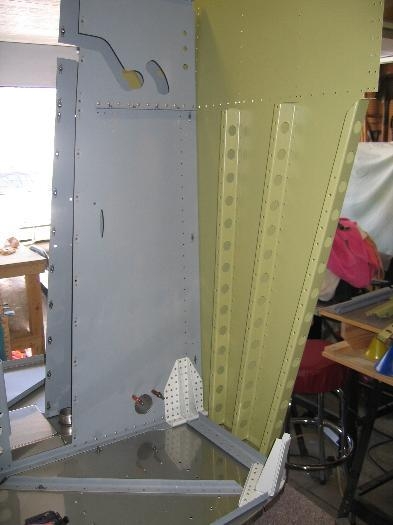 Left forward fuselage floor ribs riveted