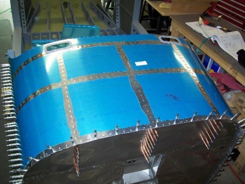 The upper fuselage skin all riveted