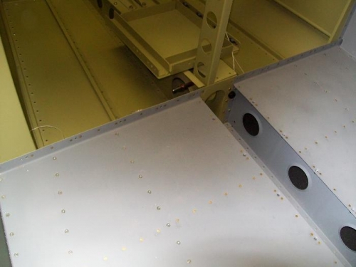 Nutplates and rivets set on the rear flange