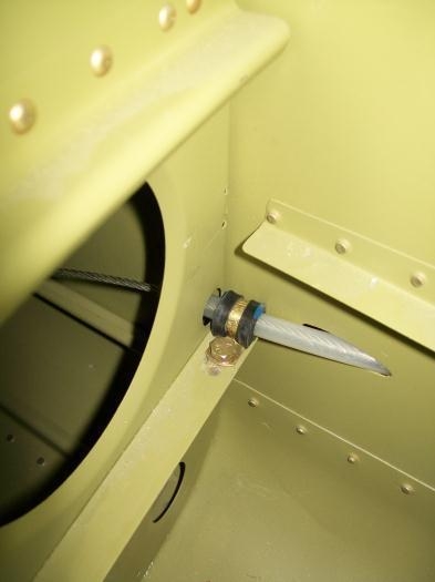 Adel clamp holding the aft end of the rudder cable in the tailcone